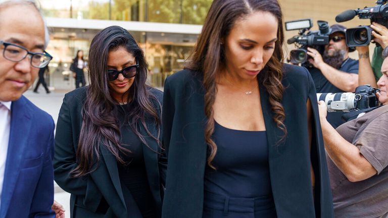 Vanessa Bryant, second from left, the widow of the late Kobe Bryant, and friend Sydney Leroux, right, leave a federal courthouse in Los Angeles on Friday, August 19, 2022. Vanessa Bryant testified on Friday that she was only beginning to mourn the loss of her husband, basketball star Kobe Bryant, and their 13-year-old daughter Gianna when she was faced with the new horror of learning that sheriff's deputies and firefighters had shot and shared photos of their bodies at the scene of the accident helicopter crash that killed them.  (AP Photo/Damian Dovarganes)