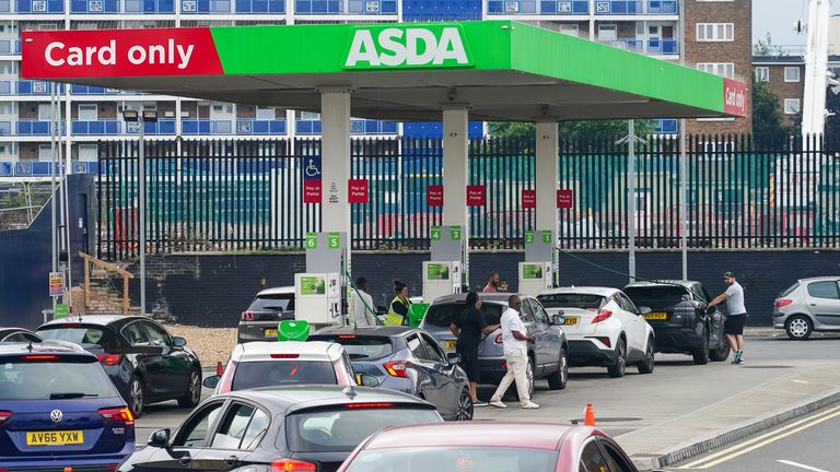 Cars queue for fuel at an Asda petrol station in south London. Picture date: Sunday September 26, 2021.
