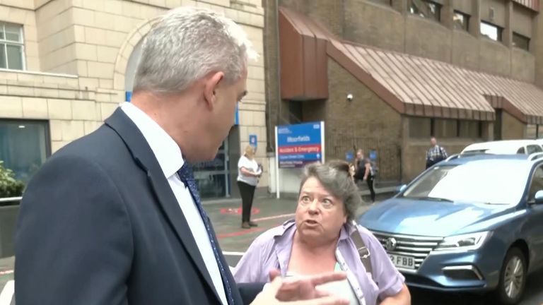 Woman angrily confronts health secretary over ‘people dying’ due to ambulance waits
