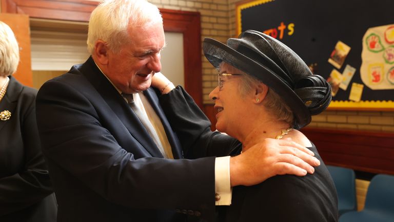 Former taoiseach Bertie Ahern embraces Lady Daphne Trimble at the funeral service