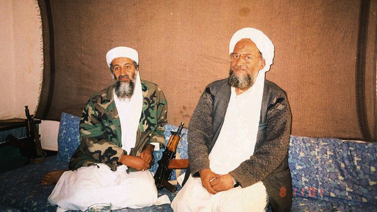 Ayman al-Zawahiri, right, with an image of Osama bin Laden appearing in November 2001