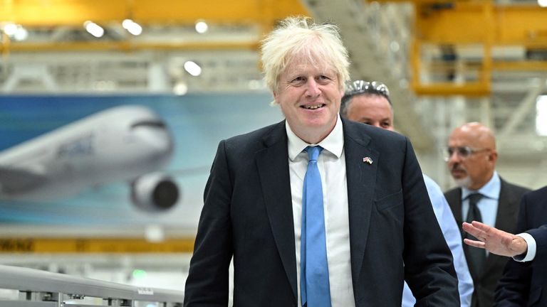 Britain&#39;s Prime Minister Boris Johnson listens to Head of Broughton plant at Airbus Jerome Blandin (R) during a visit of the division manufacturing the wings for the A350 as part of a tour of the Broughton Airbus plant, in Chester, Britain, August 12, 2022. Oli Scarff/Pool via REUTERS
