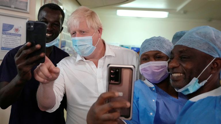  Prime Minister Boris Johnson poses for photographs as he meets members of staff during a visit to South West London Orthopaedic Centre in Epsom, Surrey