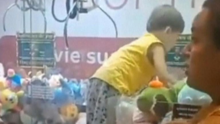 Boy somehow climbs inside a soft toy machine in Brazil