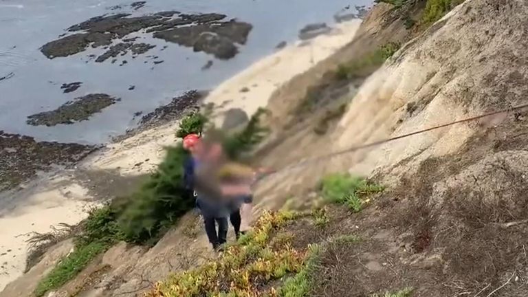 Hiker rescued after cliff crumbles under him