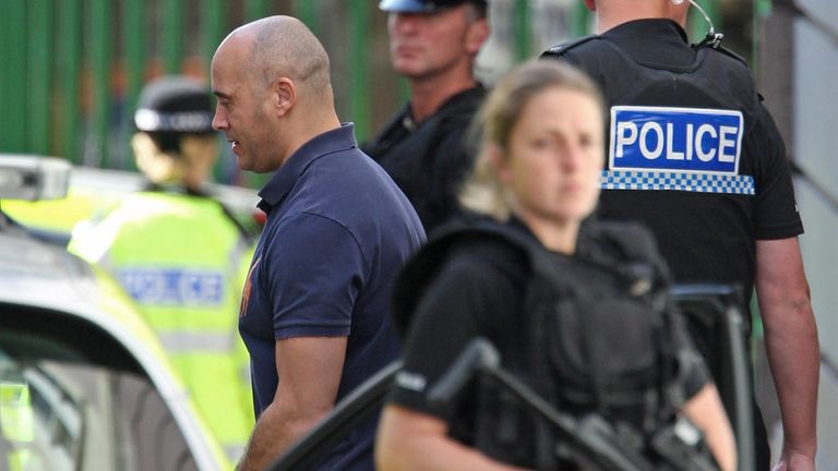 Armed police guard the transfer of Curtis Warren from the Royal Court in Jersey