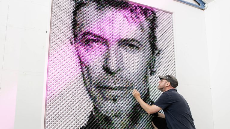 Artist Joe Black adds the finishing touches to a portrait of David Bowie made from over 8500 guitar plectrums, commissioned by Sky Arts to celebrate Bowie topping the list of Britain&#39;s 50 most influential artists of the last 50 years . Issue date: Thursday August 11, 2022.