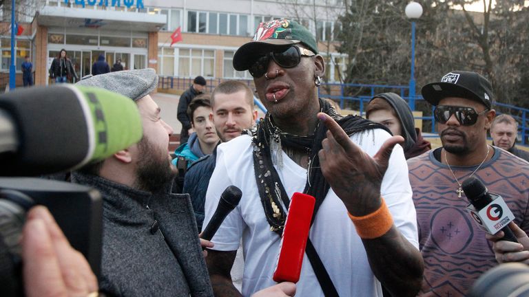 Retired U.S. basketball star Dennis Rodman (C) talks to journalists outside the Russian State University of Physical Education, Sport, Youth and Tourism in Moscow, November 28, 2014. REUTERS/Ivan Burnyashev (RUSSIA - Tags: SPORT BASKETBALL)