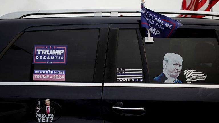 Pro former U.S. President Donald Trump decals sit on a supporter's car during a gathering outside his Mar-a-Lago home after Trump said that FBI agents raided it in Palm Beach, Florida, U.S. August 9, 2022. REUTERS/Marco Bello
