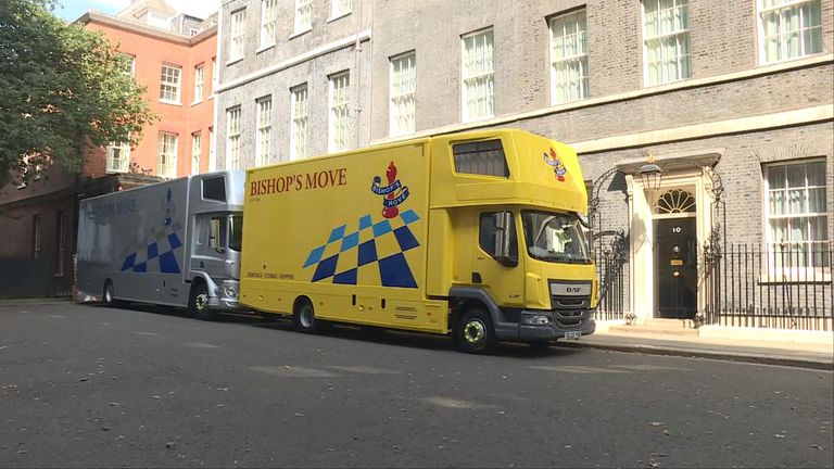 Moving vehicles are seen in Downing Street ahead of Boris Johnson's scheduled departure in September