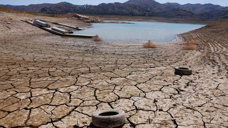 Tires lie on the cracked ground of the La Vinuela reservoir during severe drought in La Vinuela, near Malaga, southern Spain August 8, 2022. A prolonged dry spell and extreme heat caused last July became the hottest month in Spain since at least 1961, already Official data shows that reservoirs in Spain reached only 40% of their capacity in early August, much lower than with a 10-year average of about 60%.