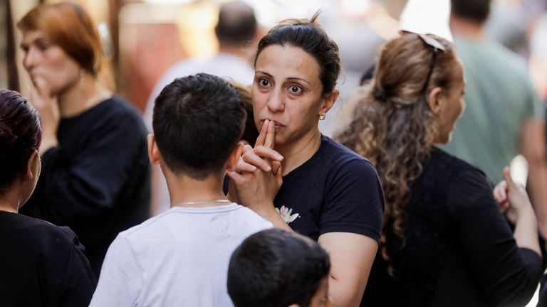 A woman reacts after a deadly fire broke out at the Abu Sifin church, in Giza, Egypt, August 14, 2022. REUTERS/Mohamed Abd El Ghany
