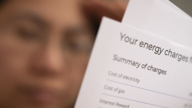 MODEL File photo dated 08/01/22 of a person holding an energy bill. Households already owe £1.3 billion to their energy suppliers two months before bills are set to soar by more than 80%. The overall debt bill is already three times higher than it was a year ago, experts at Uswitch said on Wednesday, and it seems likely it will grow further over the winter. Issue date: Wednesday August 10, 2022.