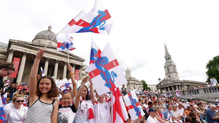 England fans wave flags during a fan celebration to commemorate England&#39;s historic UEFA Women&#39;s EURO 2022 triumph in Trafalgar Square, London. Picture date: Monday August 1, 2022.