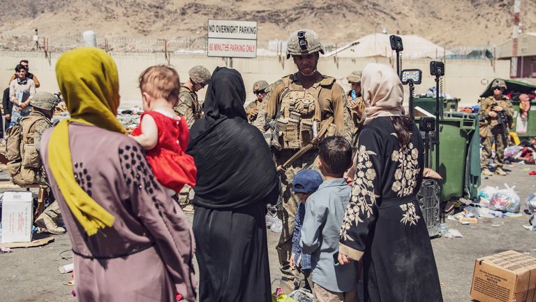 U.S. Marines with the 24th Marine Expeditionary Unit (MEU) process evacuees as they go through the Evacuation Control Center (ECC) during an evacuation at Hamid Karzai International Airport, Kabul, Afghanistan, August 28, 2021. U.S. Marine Corps/Staff Sgt. Victor Mancilla/Handout via REUTERS. THIS IMAGE HAS BEEN SUPPLIED BY A THIRD PARTY. TPX IMAGES OF THE DAY