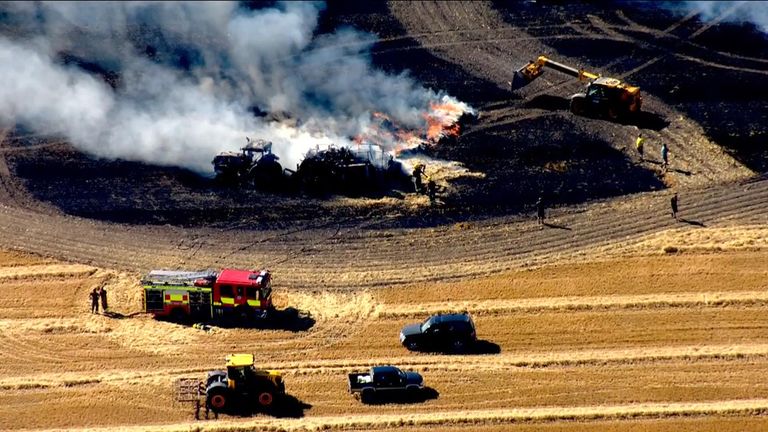 Tractor burnt after field fires in UK