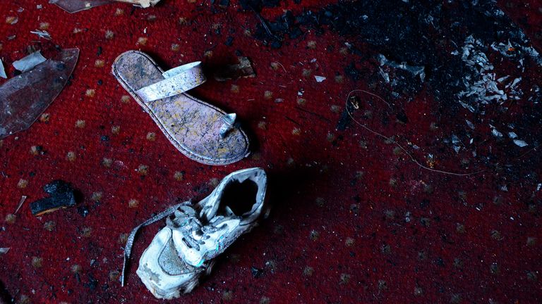 Abandoned shoes remain at the site of a fire inside the Abu Sefein Coptic church. Pic: AP