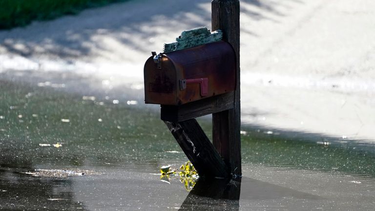Debris laden flood waters surround this mailbox in a northeast Jackson, Miss., neighborhood, Monday, Aug. 29, 2022. Flooding affected a number neighborhoods that are near the Pearl River. (AP Photo/Rogelio V. Solis)