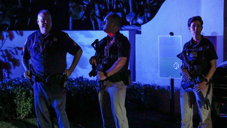 Secret service members stand guard outside former U.S. President Donald Trump's Mar-a-Lago home after Trump said that FBI agents raided it, in Palm Beach, Florida, U.S., August 8, 2022. REUTERS/Marco Bello 