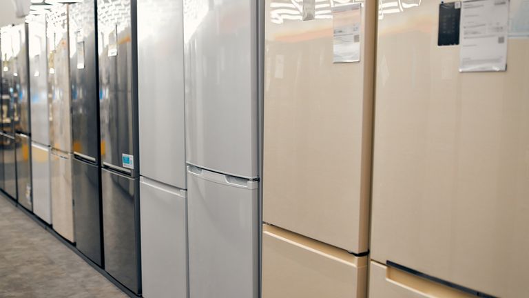 An assortment of beautiful stylish refrigerators in a gadget, electronics and home appliance store.