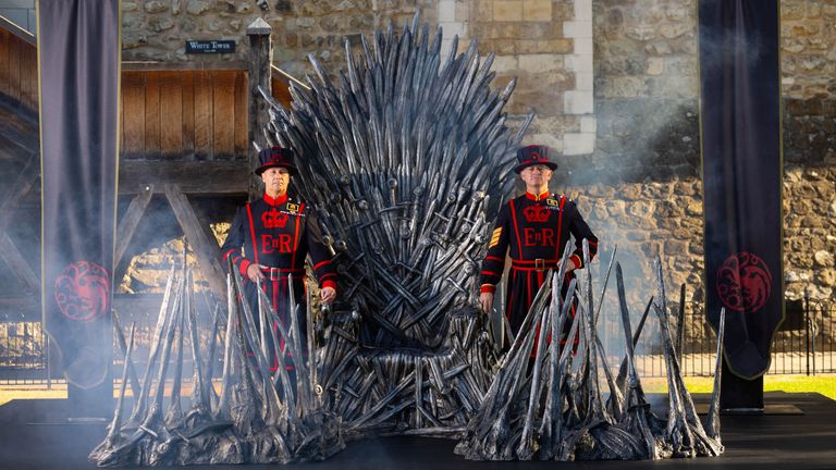 Beefeaters defend the Iron Throne in front of the White Tower