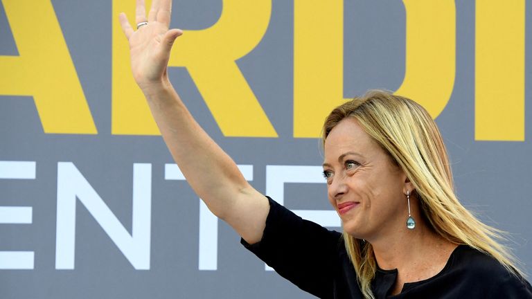 FILE PHOTO: Leader of the far-right Brothers of Italy party Giorgia Meloni waves to the people as she closes her electoral campaign ahead of local elections that will take place at the weekend, in Florence, Italy, September 18, 2020. REUTERS/Alberto Lingria/File Photo
