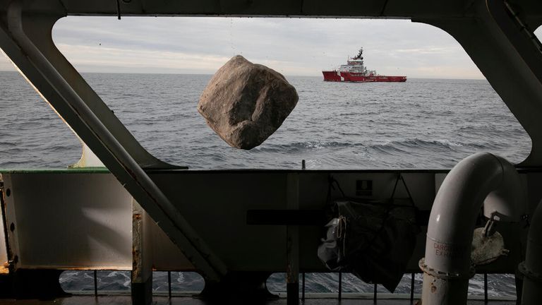 View from MY Esperanza
A boulder falls into the English channel from the Greenpeace ship, Esperanza with Marine Management Organisation Fisheries Patrol boat seen in the background.
Inert granite boulders were being placed into the English Channel as part of a new bottom trawler exclusion zone in the Offshore Brighton Marine Protected Area.
The initiative will help prevent destructive bottom trawling which destroys the Offshore Brighton MPA&#39;s protected seabed.
Pic: Suzanne Plunkett / Greenpeace