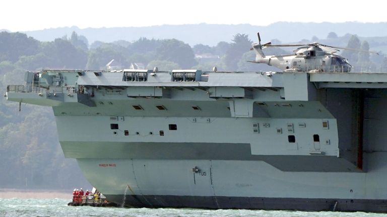 Engineers inspect aircraft carrier HMS Prince of Wales as it sits off the coast of Gosport, Hampshire, after it suffered a propeller shaft malfunction. The GBP 3 billion warship left Portsmouth Naval Base on Saturday before an "emerging mechanical issue" occurred off the south-east coast of the Isle of Wight. Picture date: Tuesday August 30, 2022.

