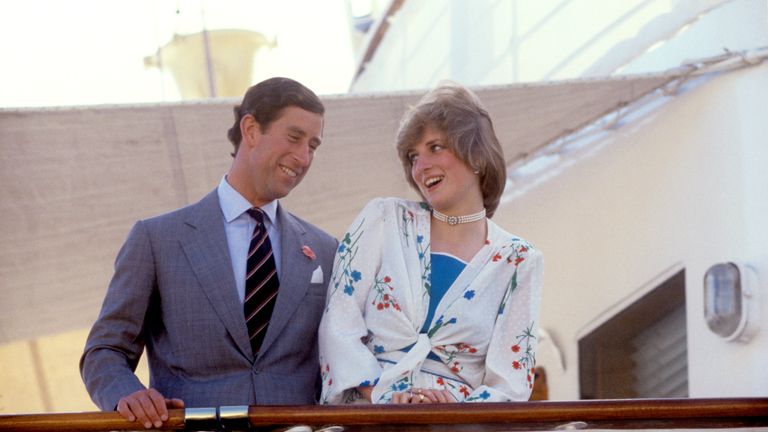 The laughing cavalier and his lady, the Prince and Princess of Wales, in a merry mood aboard the Royal Yacht Britannia as she sails away from Gibraltar today for the rest of their honeymoon.