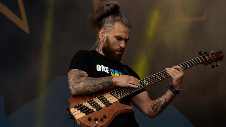 Eugene Abdukhanov on stage with Jinjer