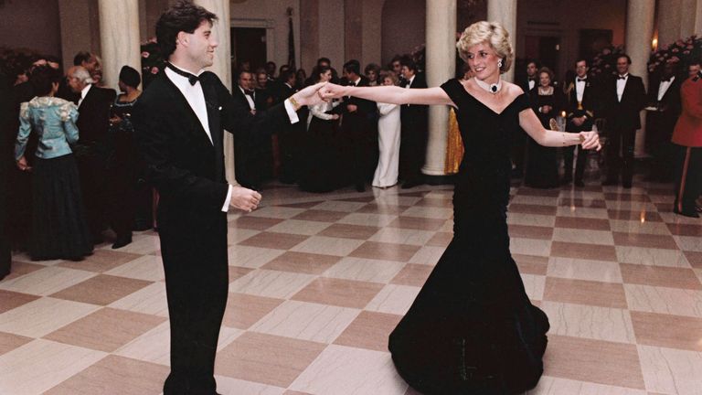 FILE - In this Nov. 9, 1985 photo provided by the Ronald Reagan Library, actor John Travolta dances with Princess Diana at a White House dinner in Washington. This outfit is featured in an exhibition of 25 dresses and outfits worn by Diana entitled "Diana: Her Fashion Story" at Kensington Palace in London, opening on Friday, Feb. 24, 2017. 
PIC:Ronald Reagan Library/AP