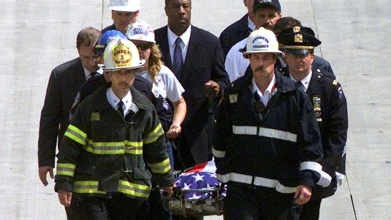 Joseph Pfeifer (front left) helping to carry a stretcher away from Ground Zero