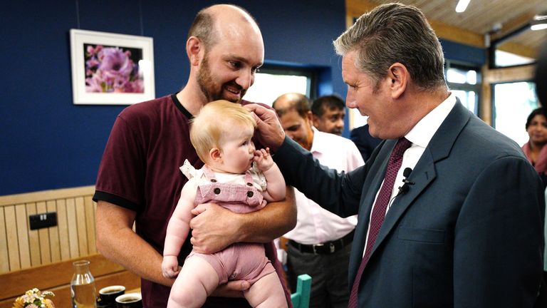 Sir Keir Starmer (right) meets Dave Church and his ten-month-old daughter Ellen, during a visit to ParkLife Heavitree in Exeter to discuss the cost of living. Picture date: Monday August 15, 2022.


