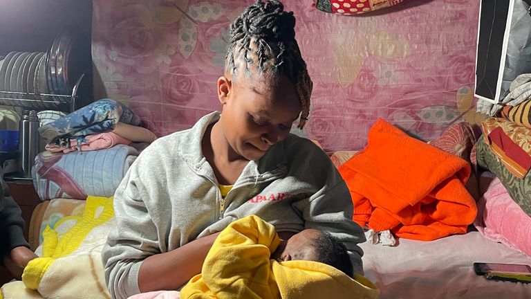Ruth breastfeeds her 3-month-old baby April in the Mukuru neighbourhood of Nairobi. She is worried about election violence