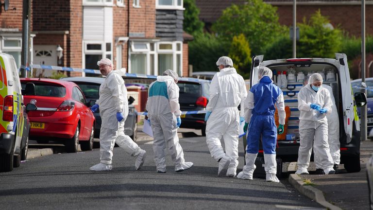 Forensic officers near to the scene in Kingsheath Avenue, Knotty Ash, Liverpool, where a nine-year-old girl has been fatally shot. Officers from Merseyside Police have started a murder investigation after attending a house at 10pm Monday following reports that an unknown male had fired a gun inside the property. Picture date: Tuesday August 23, 2022.

