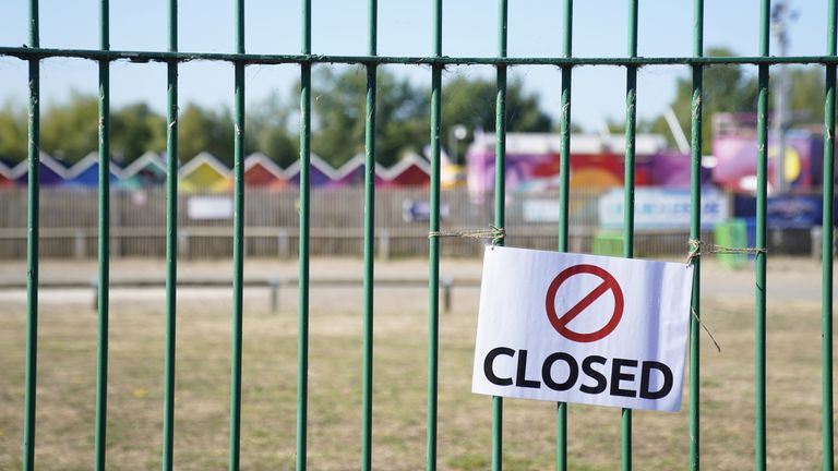 Closed signs on the gates of Liquid Leisure in Windsor, following the death of an 11-year-old girl. Emergency services were called at around 3.55pm on Saturday to reports of the child getting into difficulty at the water park near Datchet. Picture date: Sunday August 7, 2022.