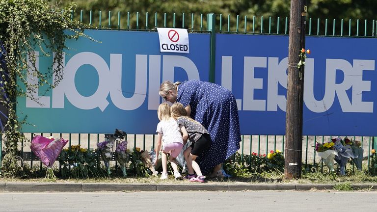 People leave flowers outside Liquid Leisure in Windsor, following the death of an 11-year-old girl. Emergency services were called at around 3.55pm on Saturday to reports of the child getting into difficulty at the water park near Datchet. Picture date: Sunday August 7, 2022.