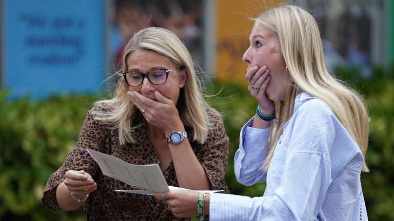 Maddie Hallam with her mother receiving her GCSE results at Norwich School, in Norwich, Norfolk. Picture date: Thursday August 25, 2022.

