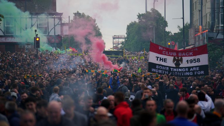 Fans take part in an organised protest march outside the ground against the Manchester United owners before the Premier League match against Liverpool at Old Trafford, Manchester. Picture date: Monday August 22, 2022.