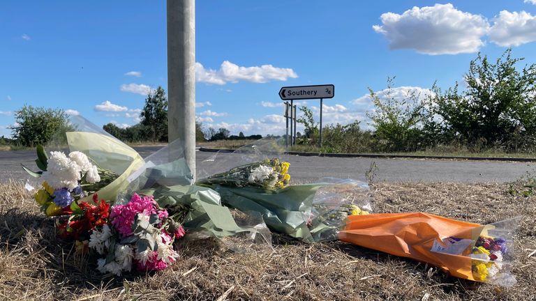 Flowers were left at the side of the A10 at Southery in Norfolk after the collision