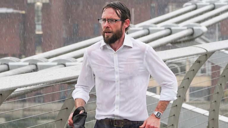 A man runs across the Millennium Bridge in London. Yellow weather warnings are in place for most of the UK on Tuesday after weeks of little rain and warm conditions have caused droughts, leaving land parched. Picture date: Tuesday August 16, 2022.


