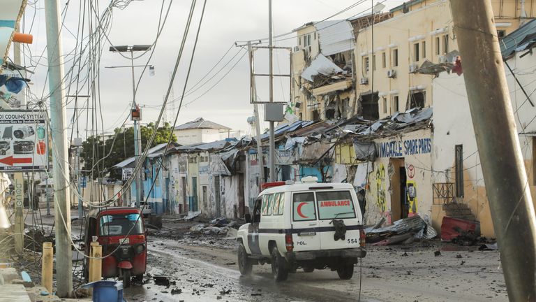 An ambulance drives past a section of Hotel Hayat, the scene of an al Qaeda-linked al Shabaab group militant attack in Mogadishu, Somalia August 20, 2022. REUTERS/Feisal Omar
