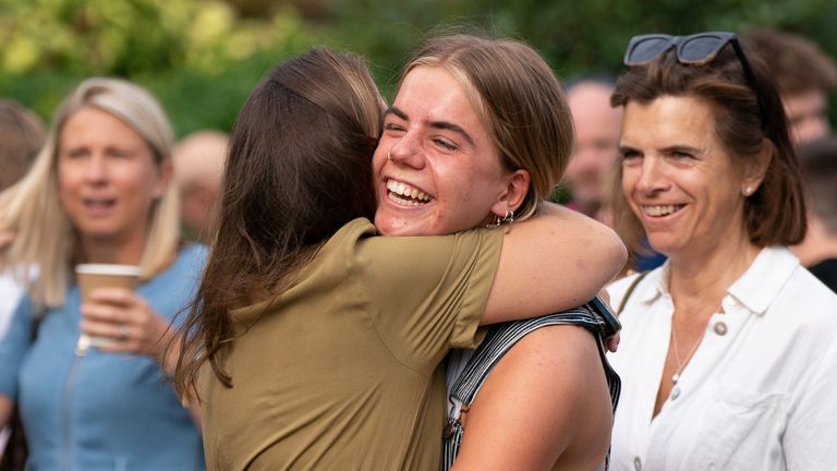 Alice Shaw hugs a friend as they receive their A-level results at Norwich School, Norwich. Picture date: Thursday August 18, 2022.

