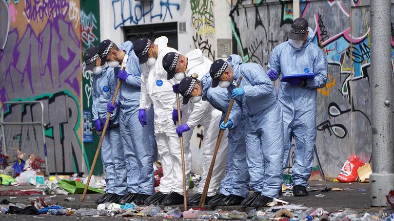 Forensics officers comb the scene in Ladbroke Grove, west London, where 21-year-old Takayo Nembhard, a rapper from Bristol, has died after being stabbed on the final day of the Notting Hill Carnival. Picture date: Tuesday August 30, 2022.