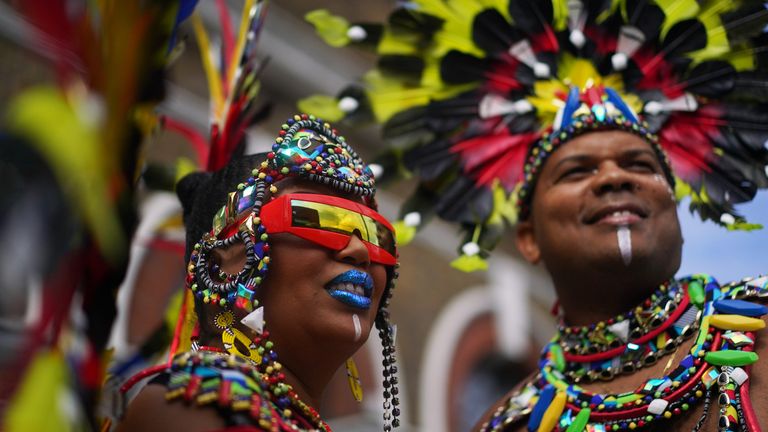 Carnival goers during the Notting Hill Carnival in London, which returned to the streets for the first time in two years after it was thwarted by the pandemic. Picture date: Monday August 29, 2022.
