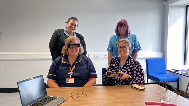 Undated handout photo issued by NHS England of a nurse wearing a NHS high-tech goggle which is being used on home visits to maximise time with patients, as part of a new NHS trial.