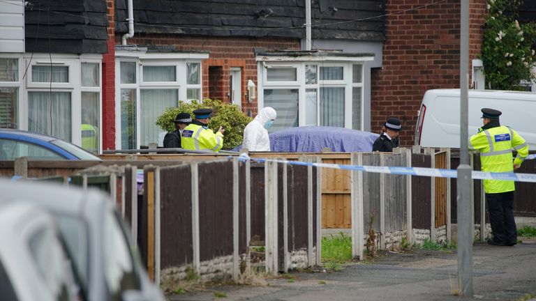 Police and forensics experts at the scene of the fatal shooting