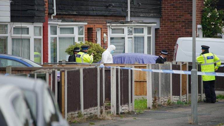 Police and forensic experts at the scene of the fatal shooting