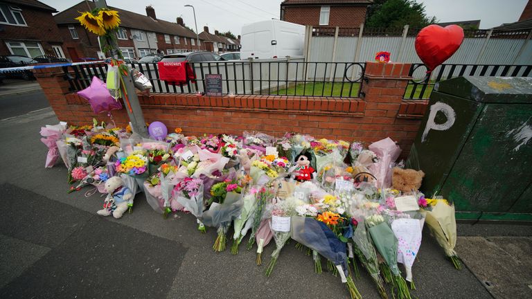 Flowers are left near to the scene of an incident in Kingsheath Avenue, Knotty Ash, Liverpool, where nine-year-old Olivia Pratt-Korbel was fatally shot on Monday night. Picture date: Thursday August 25, 2022.

