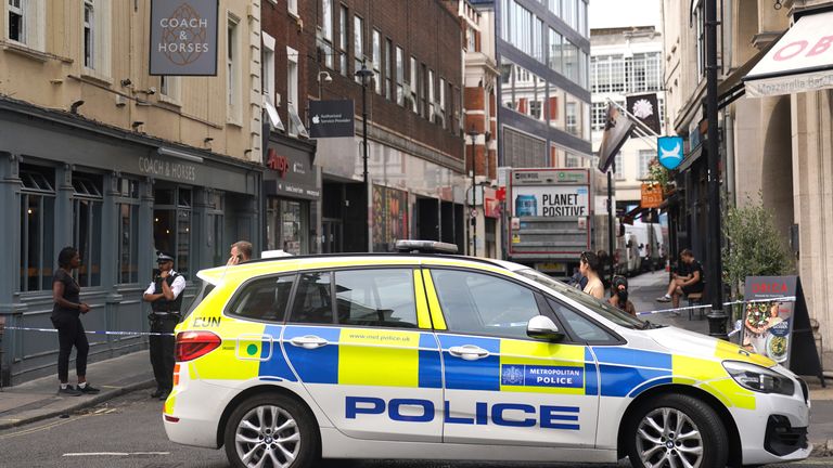 A police cordon on Poland Street in central London where a man was stabbed. death in    in side road near London's Oxford Street.

